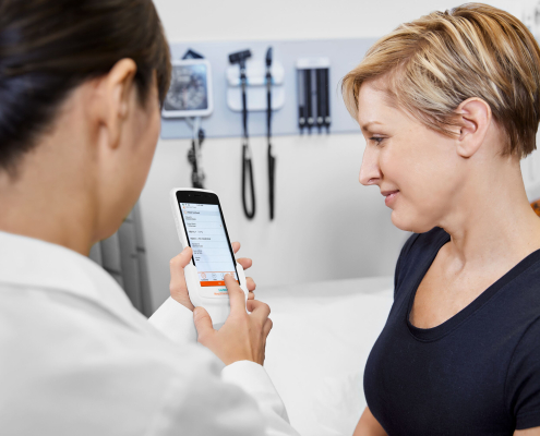 Doctor reviewing results with patient on Atellica DCA Analyzer